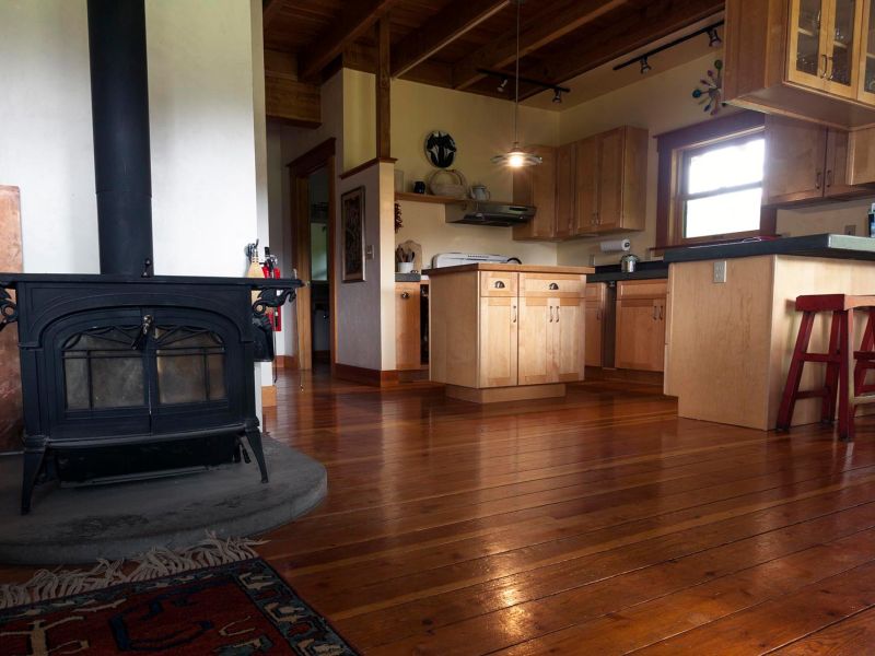 open living area with wood-burning stove