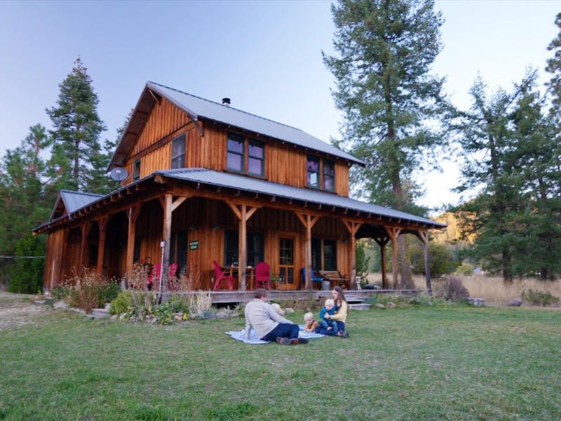 Young family relaxes on Meadow House lawn